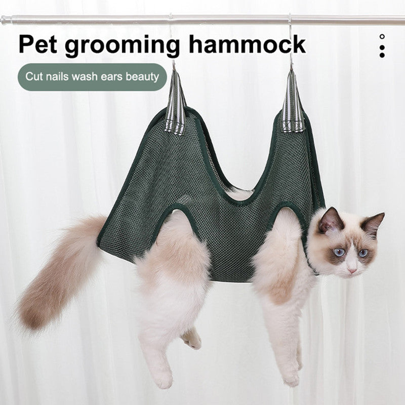 Trimming nails in the grooming hammock